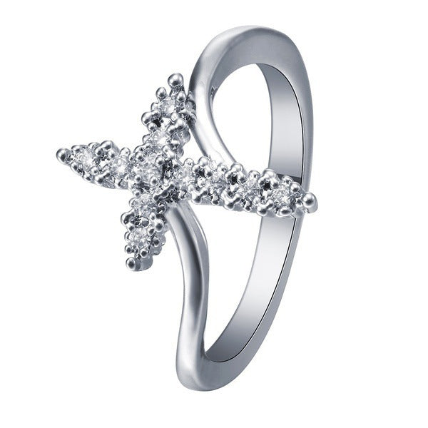 Croix avec strass sur BAGUE