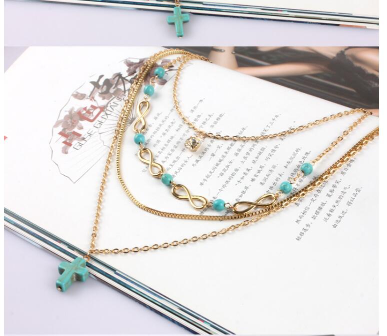 Croix turquoise multi-rangs COLLIER