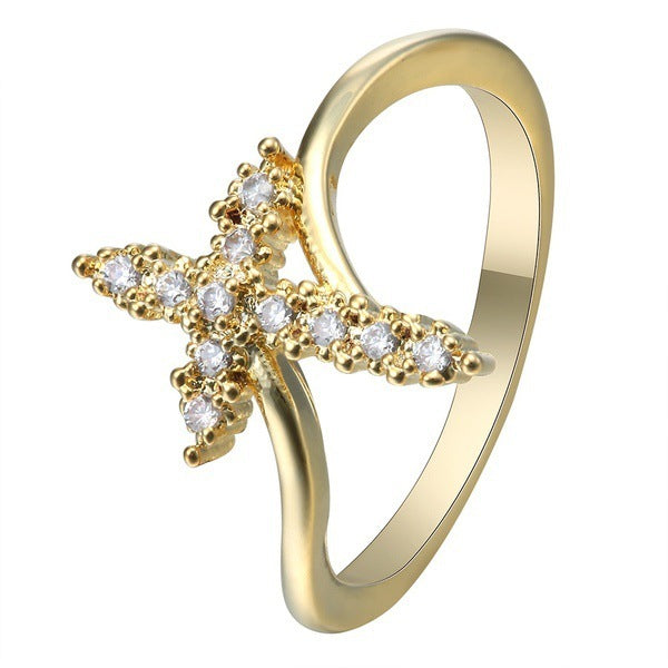 Croix avec strass sur BAGUE