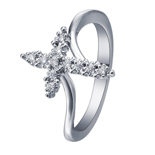 Croix avec strass sur BAGUE