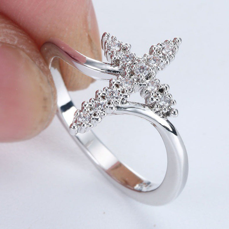 Croix avec strass sur BAGUE